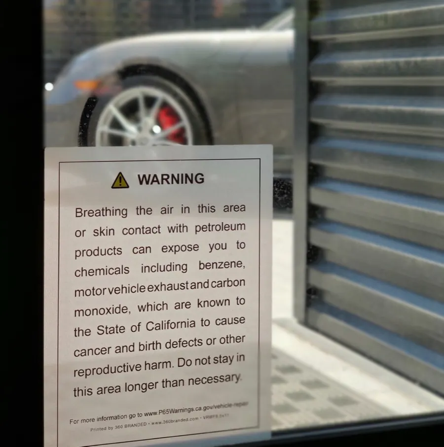 Proposition 65 warning applied to the glass at a service entrance